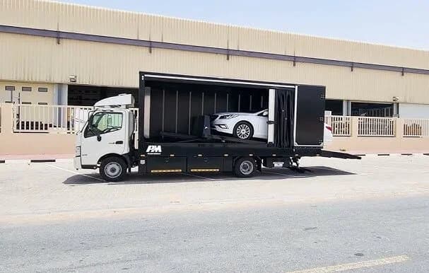Admill heavy flatbed tow truck staged for Dubai dispatch